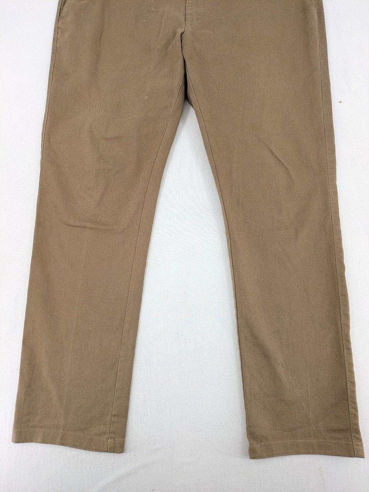 Süvari khaki chino pants flat-front design with patterned waistband detail, cotton blend material.