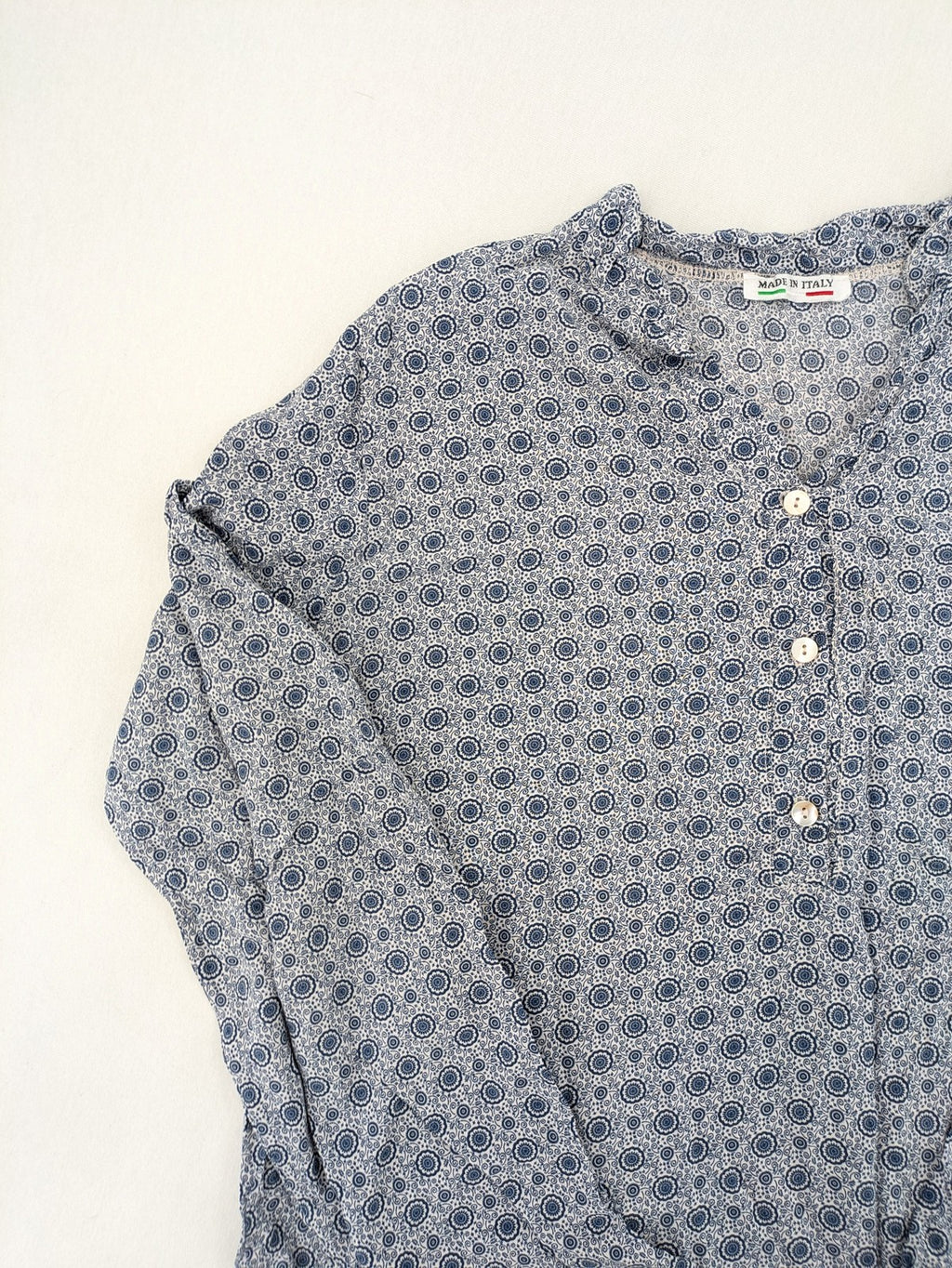 M/L blue and grey tunic top with geometric pattern and stand-up collar.