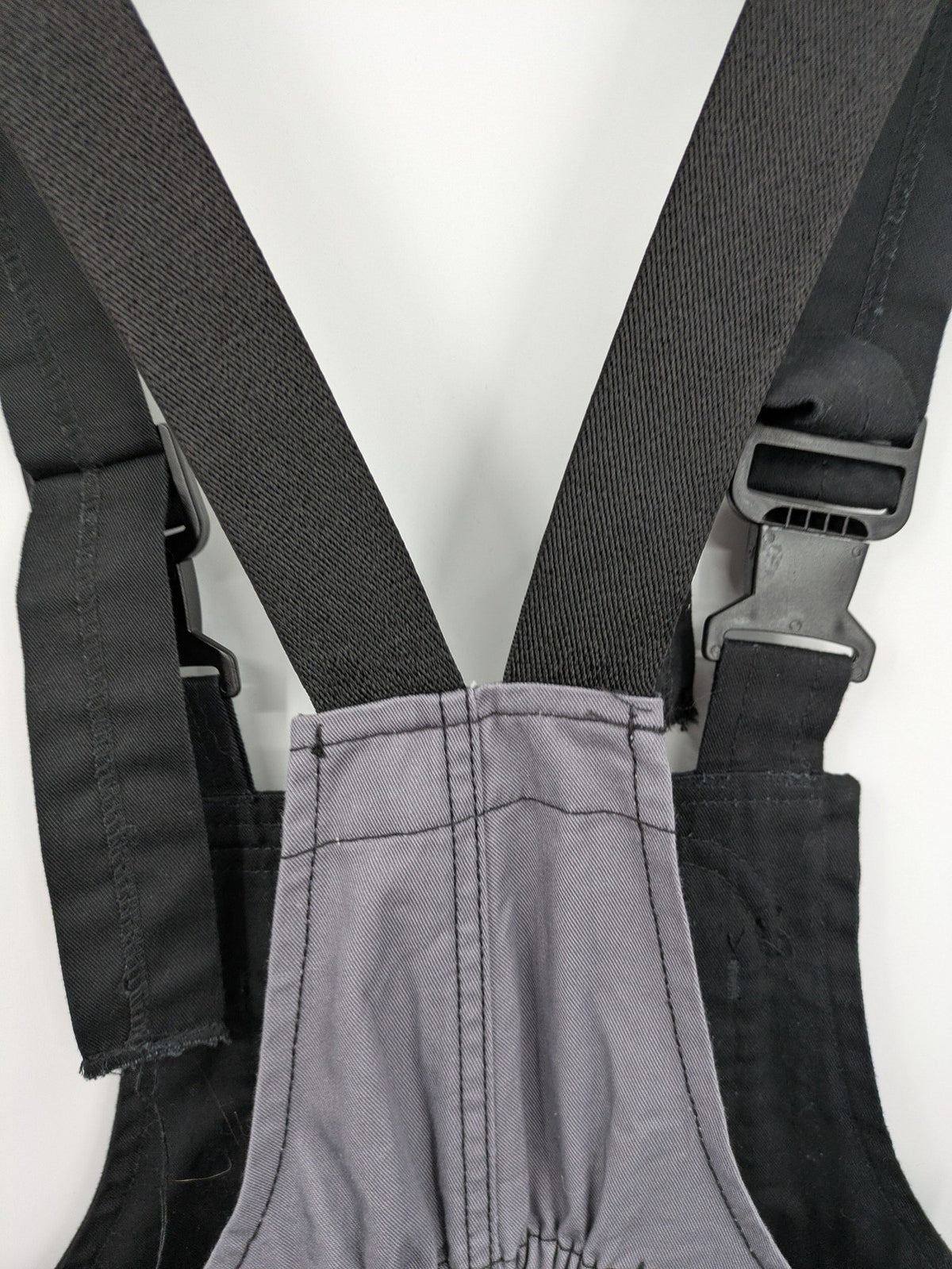 Cargo pants black grey two-tone design with red stitching and multiple pockets