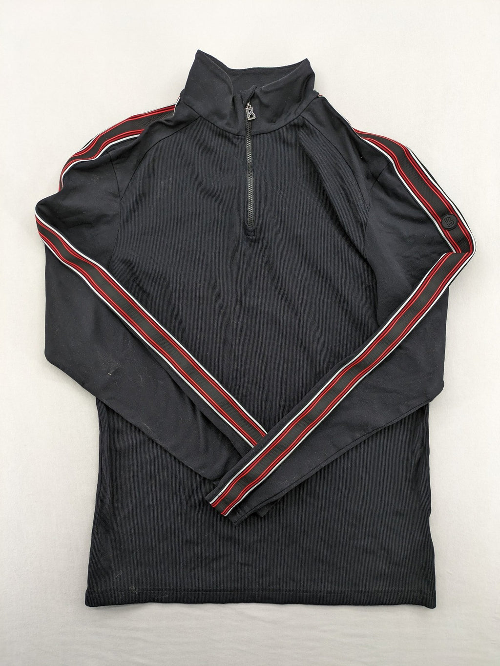 Bogner black turtle neck jumper with red and white striped sleeves and 1/4 zipper.