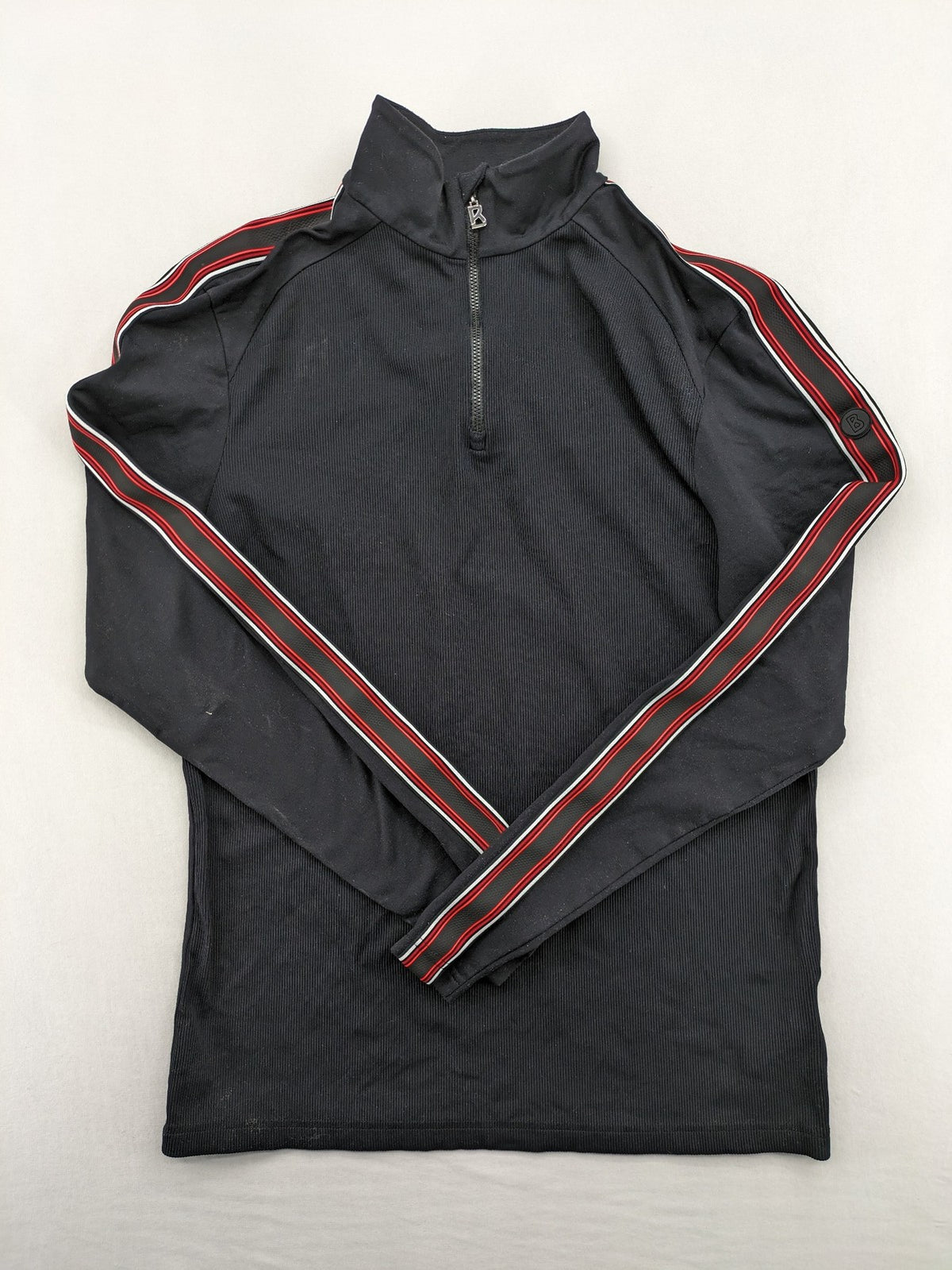 Bogner black turtle neck jumper with red and white striped sleeves and 1/4 zipper.