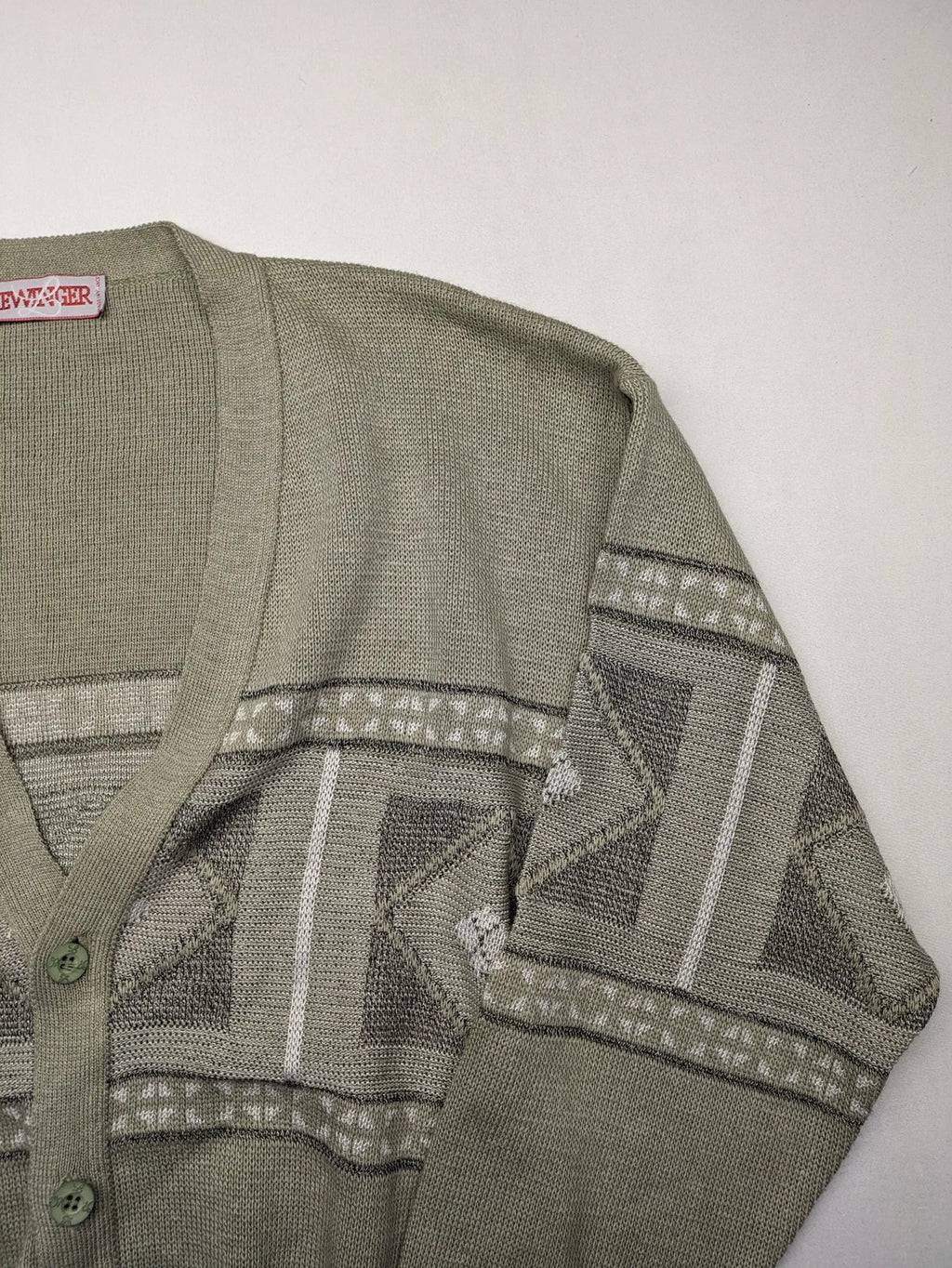 Lewträger cream and grey turtle neck jumper with geometric pattern and button placket.