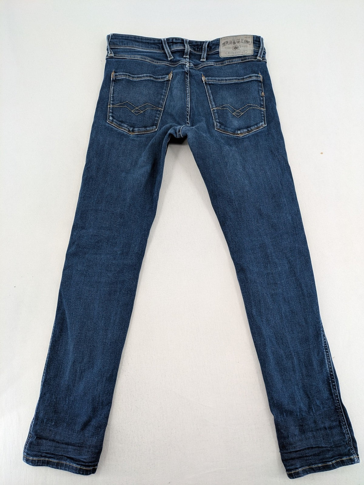 Replay slim fit jeans blue with subtle fading and stretch denim material.