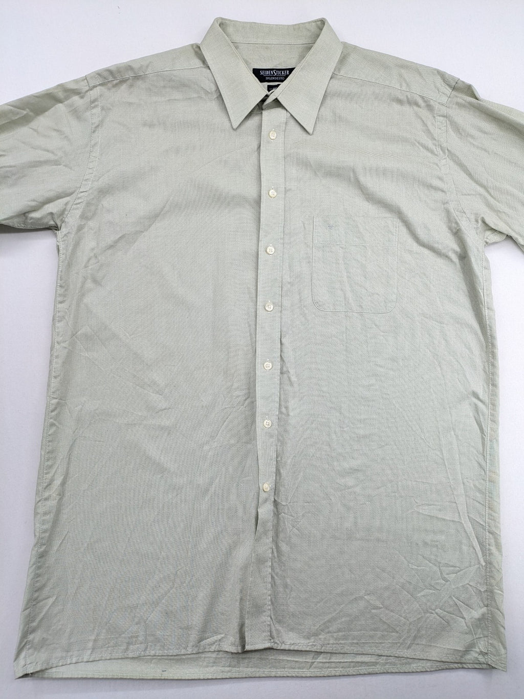 Seidensticker grey button-up shirt with subtle pattern and embroidered logo on pocket.