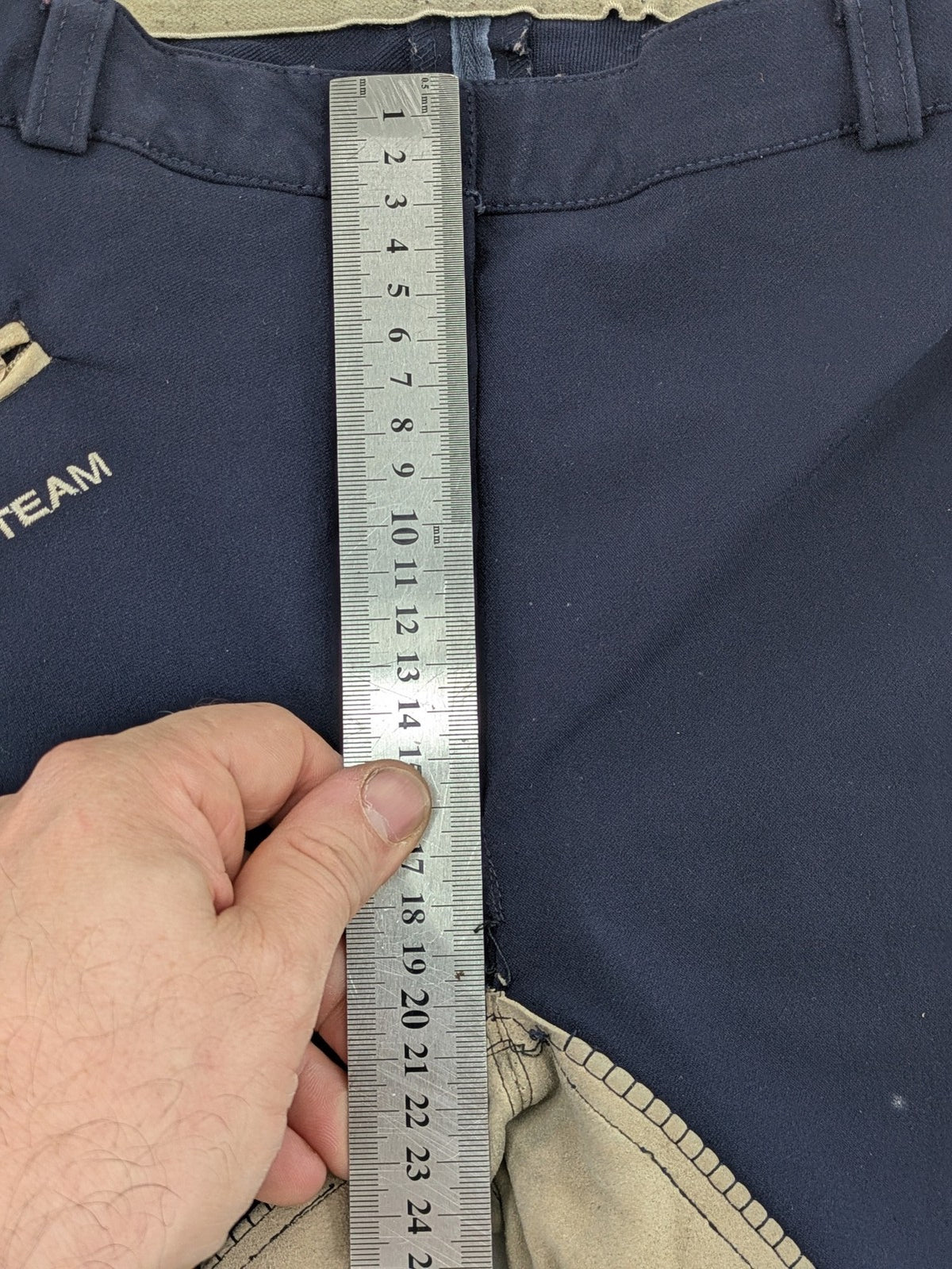 H&KM beige riding pants with dark blue full seat and front zippers.