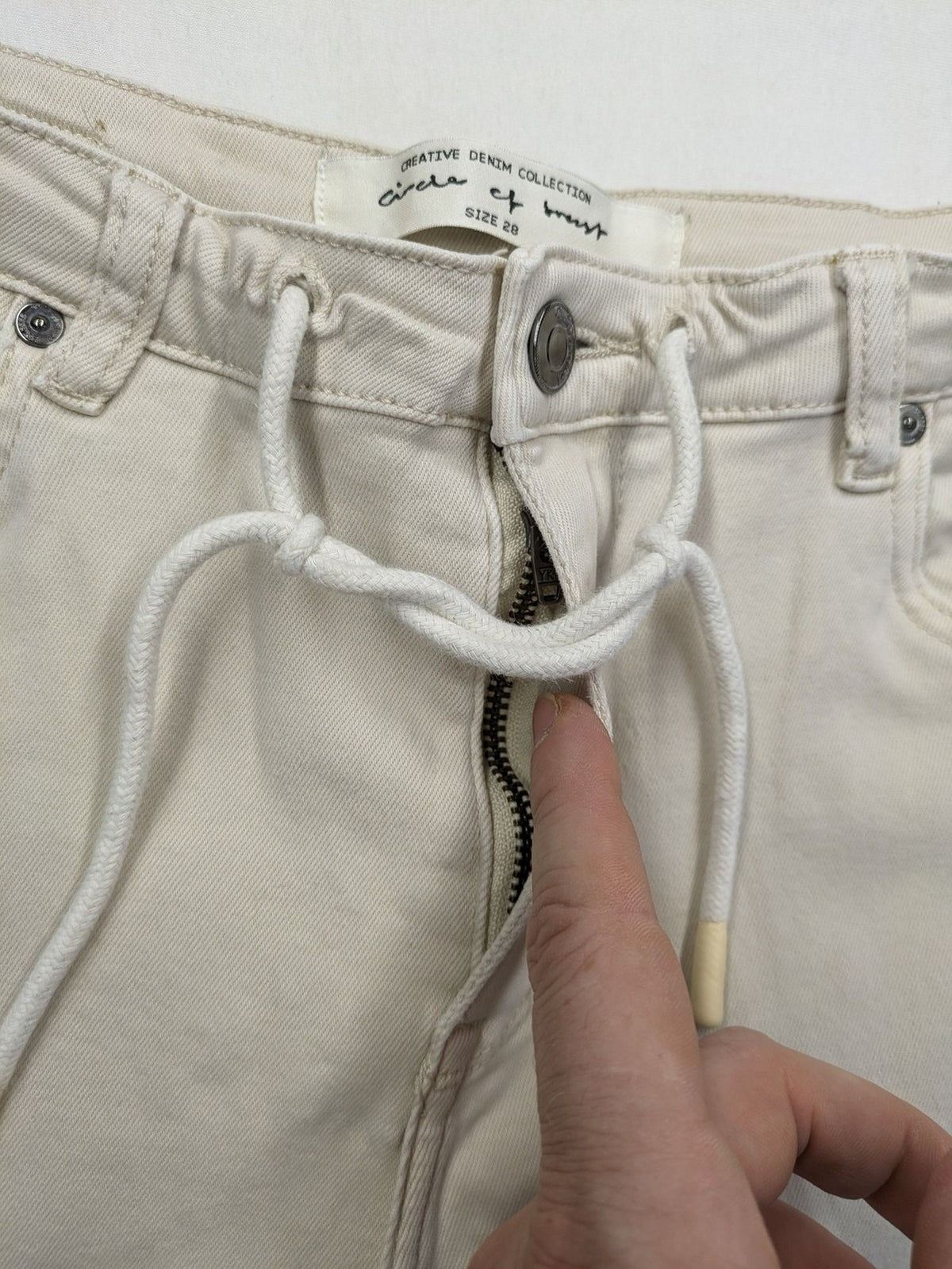 Circle Of Trust beige straight jeans with elastic waistband, drawstring, and classic 5-pocket design.
