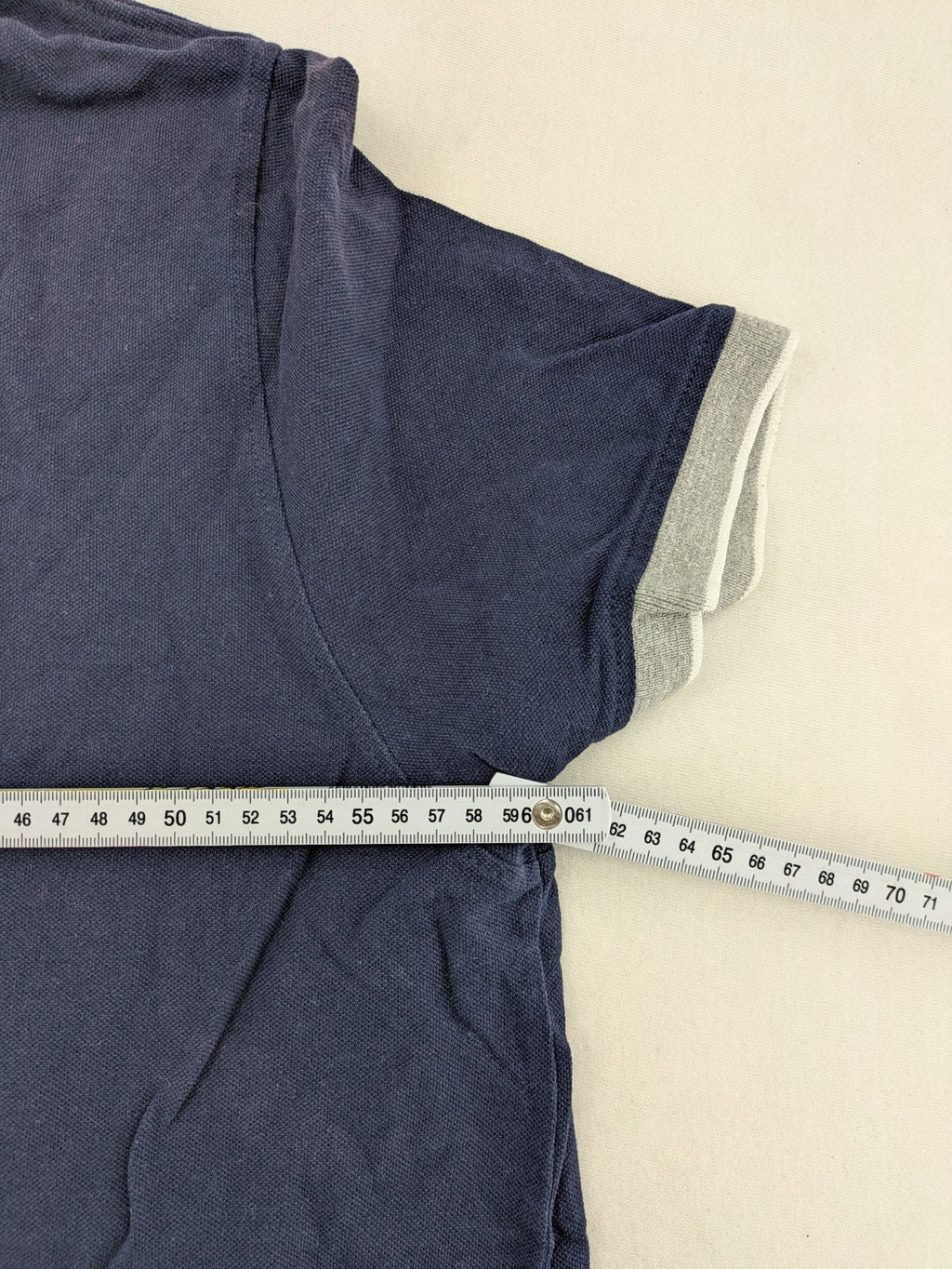 XXL navy polo shirt with grey contrast collar and cuffs, 100% cotton material.