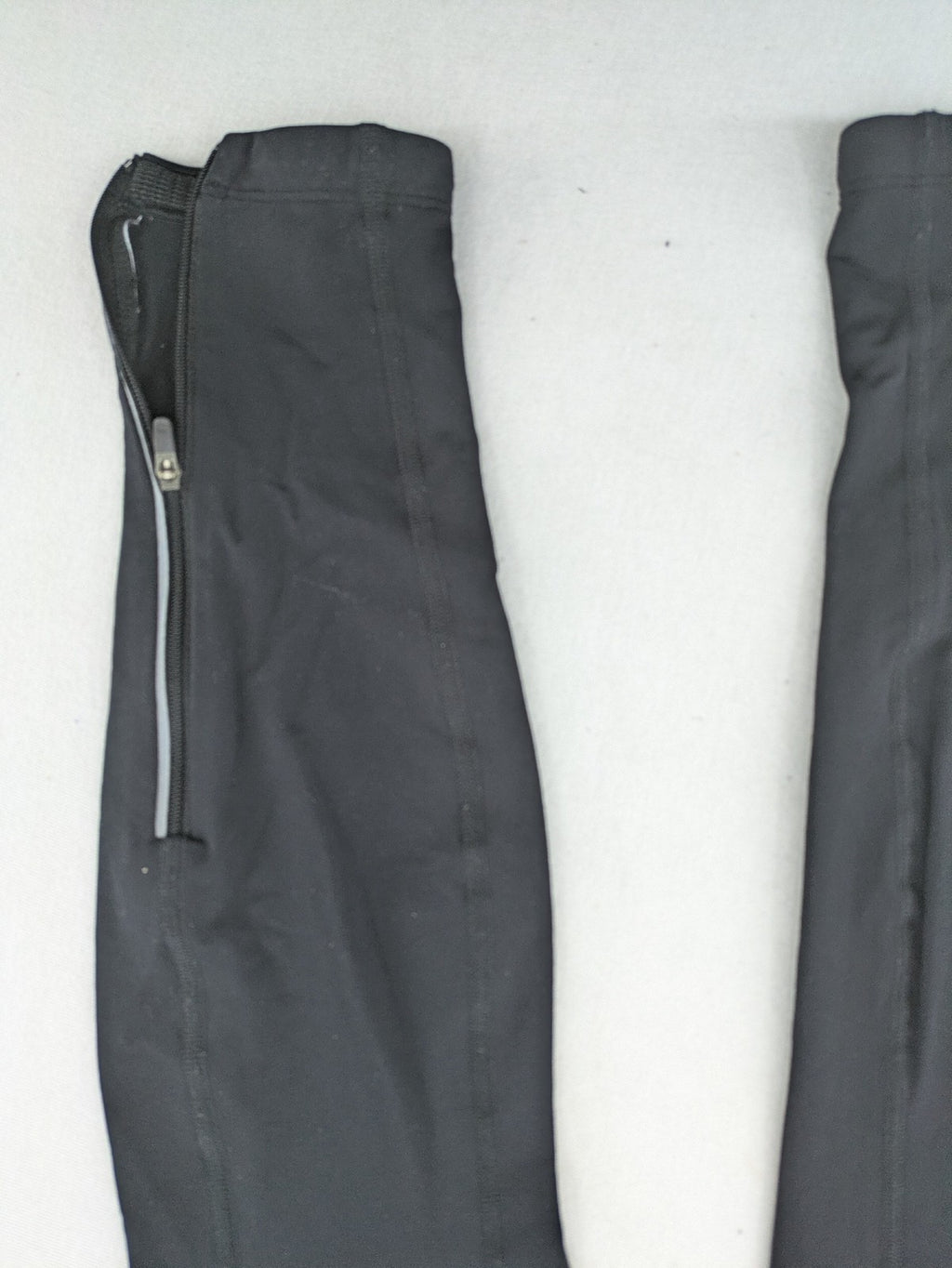 GORE RUNNING WEAR black bicycle tights with reflective details and zippered ankle openings.