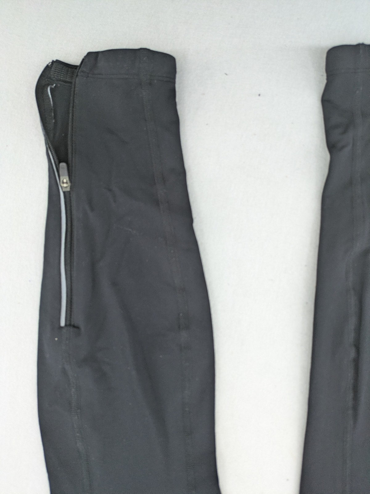 GORE RUNNING WEAR black bicycle tights with reflective details and zippered ankle openings.