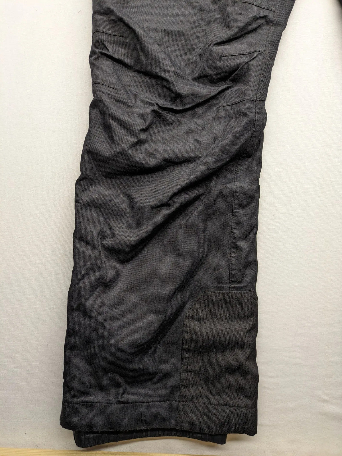 Schoffel black ski pants with adjustable straps, zip pockets, and snow gaiters.