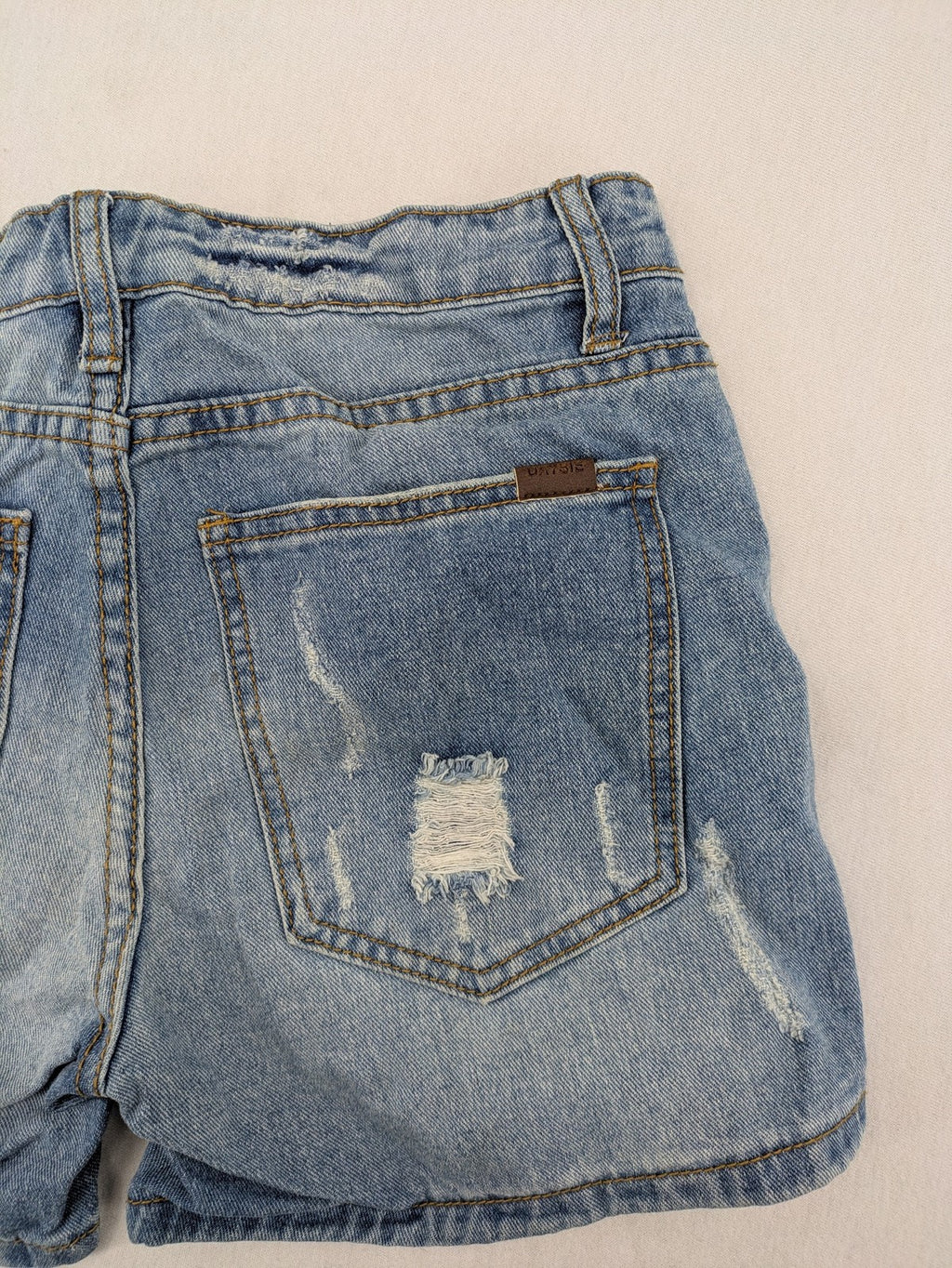 Daysie blue boyfriend jeans shorts with distressed rips and classic 5-pocket design.