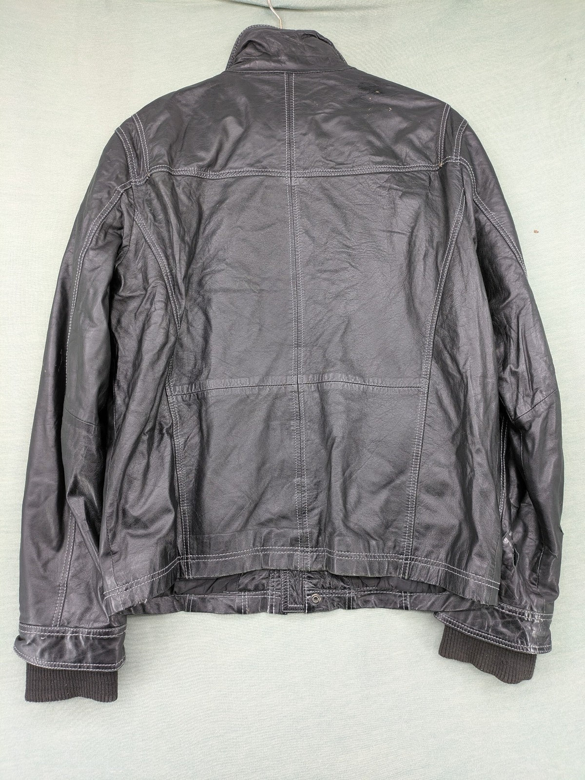 Tom Tailor black leather jacket vintage style with multiple pockets and contrast stitching.