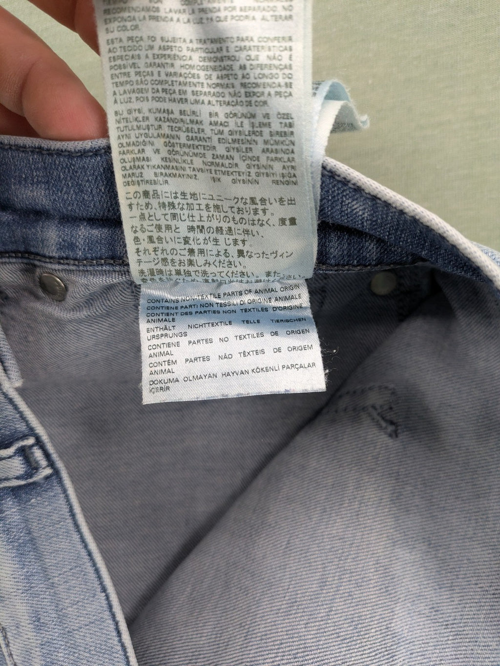 Diesel blue bootcut jeans with white patch pockets and regular waist, stylish stretch material.