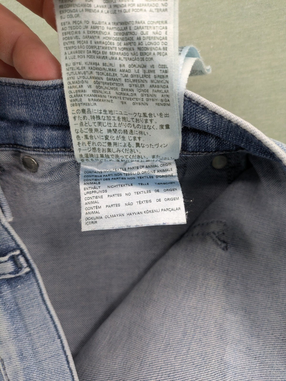 Diesel blue bootcut jeans with white patch pockets and regular waist, stylish stretch material.