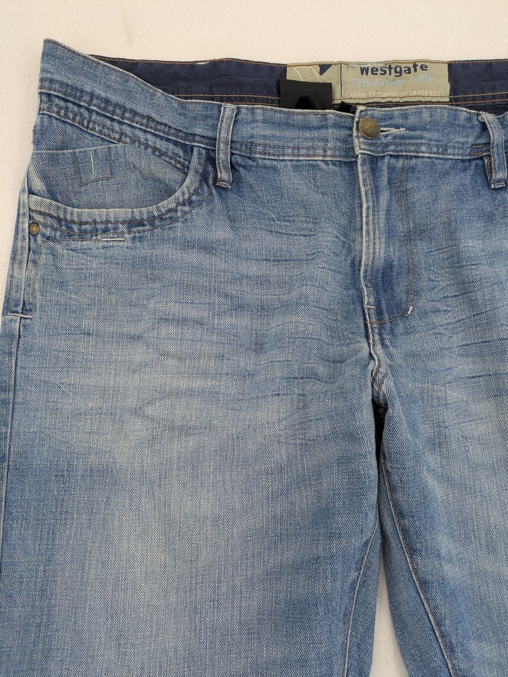 C&A blue straight jeans 5-pocket style with logo and button closure.