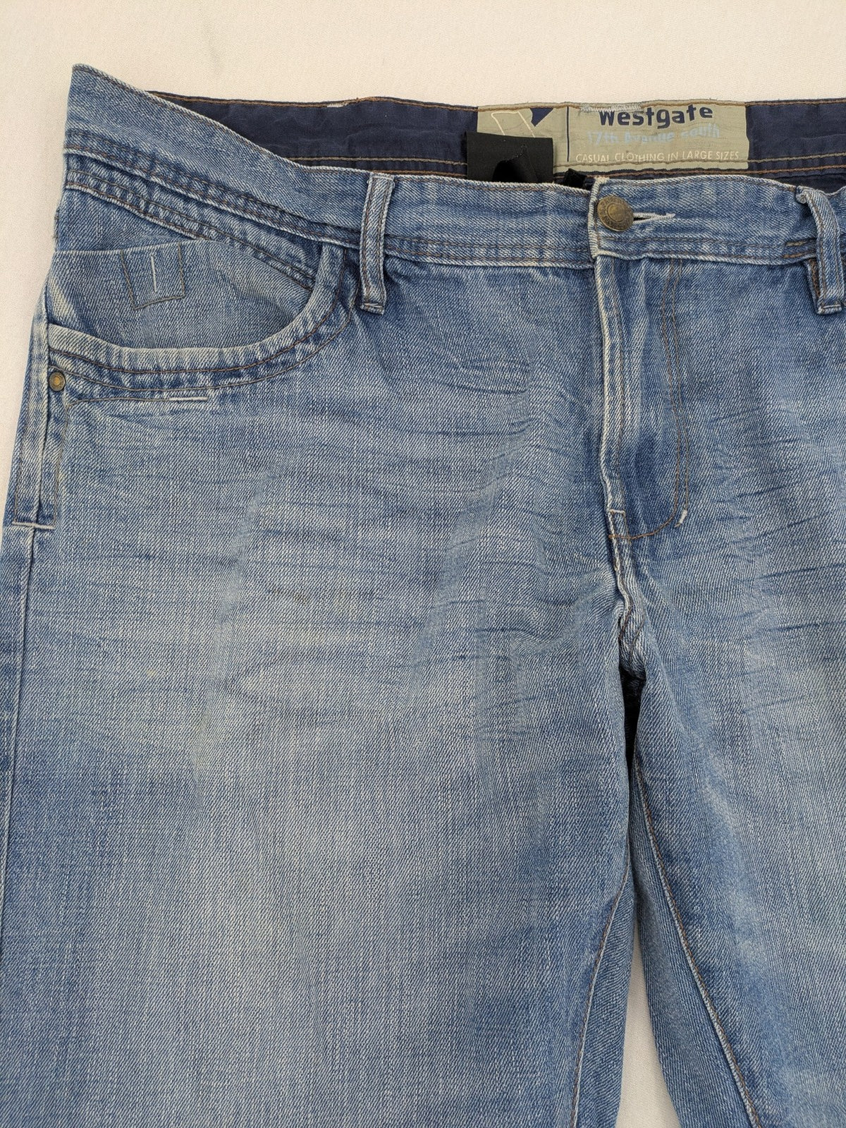 C&A blue straight jeans 5-pocket style with logo and button closure.