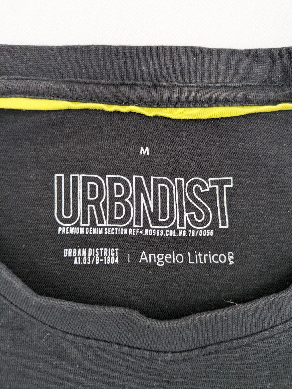 Angelo Litrico black and grey colorblock t-shirt with logo accents and soft cotton blend.