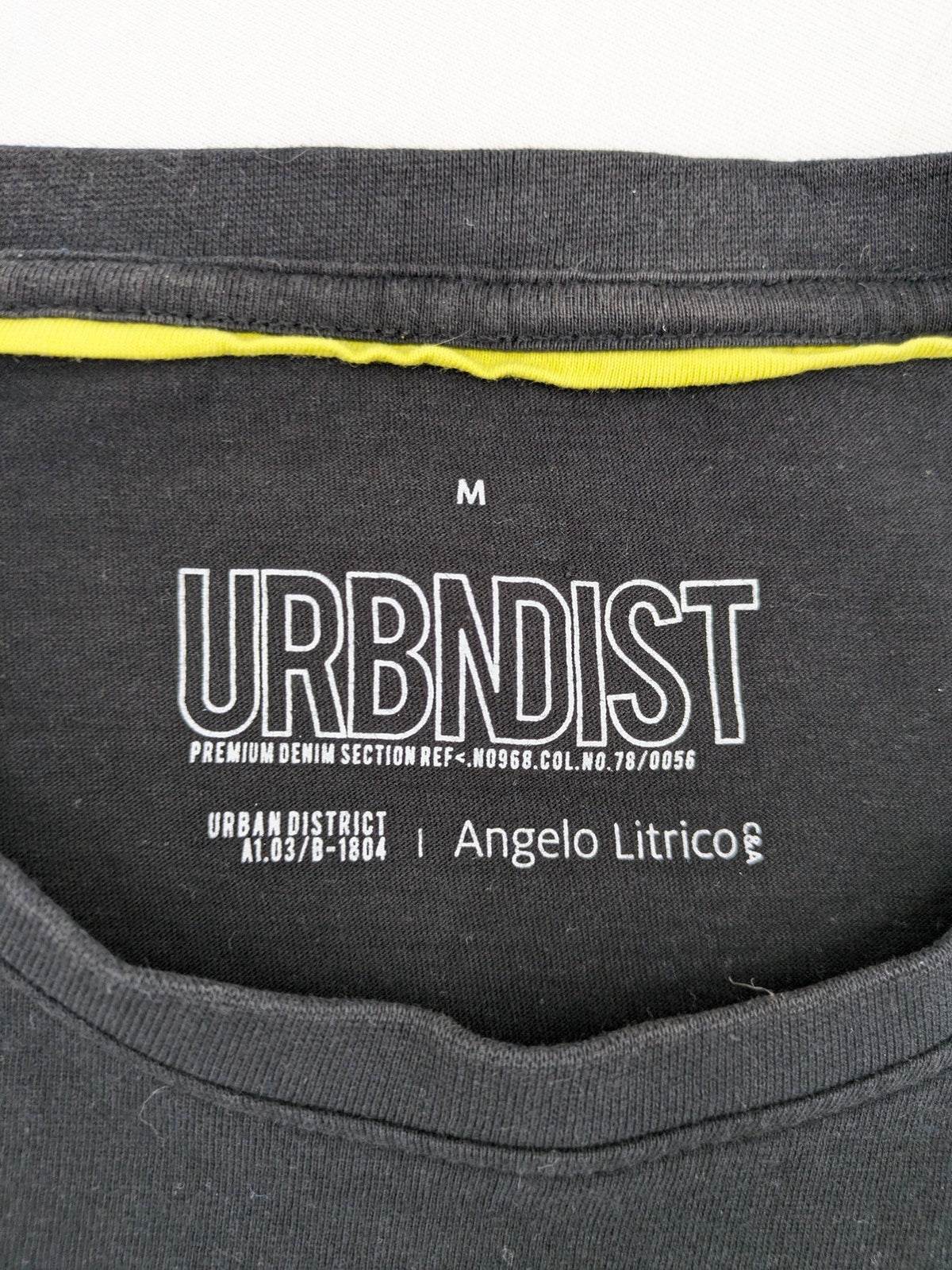 Angelo Litrico black and grey colorblock t-shirt with logo accents and soft cotton blend.