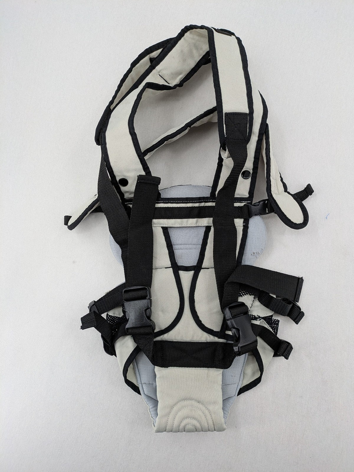 Chicco beige and black baby carrier adjustable straps with padded support for comfort.