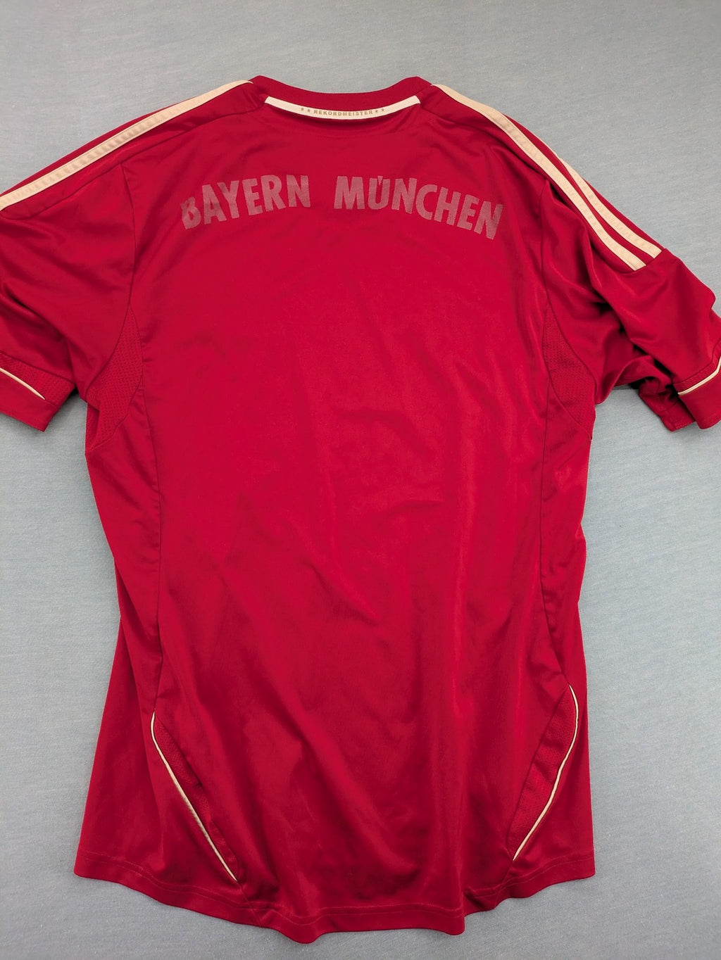 Adidas red soccer uniform with embroidered FC Bayern München crest and T-Mobile logo.