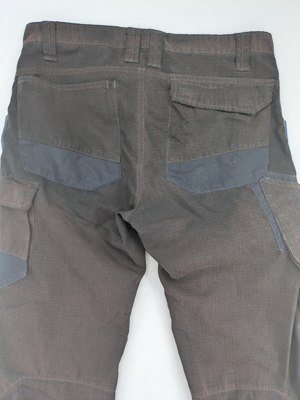 Kübler work pants blue grey Cordura fabric with multiple cargo pockets and reflective details.