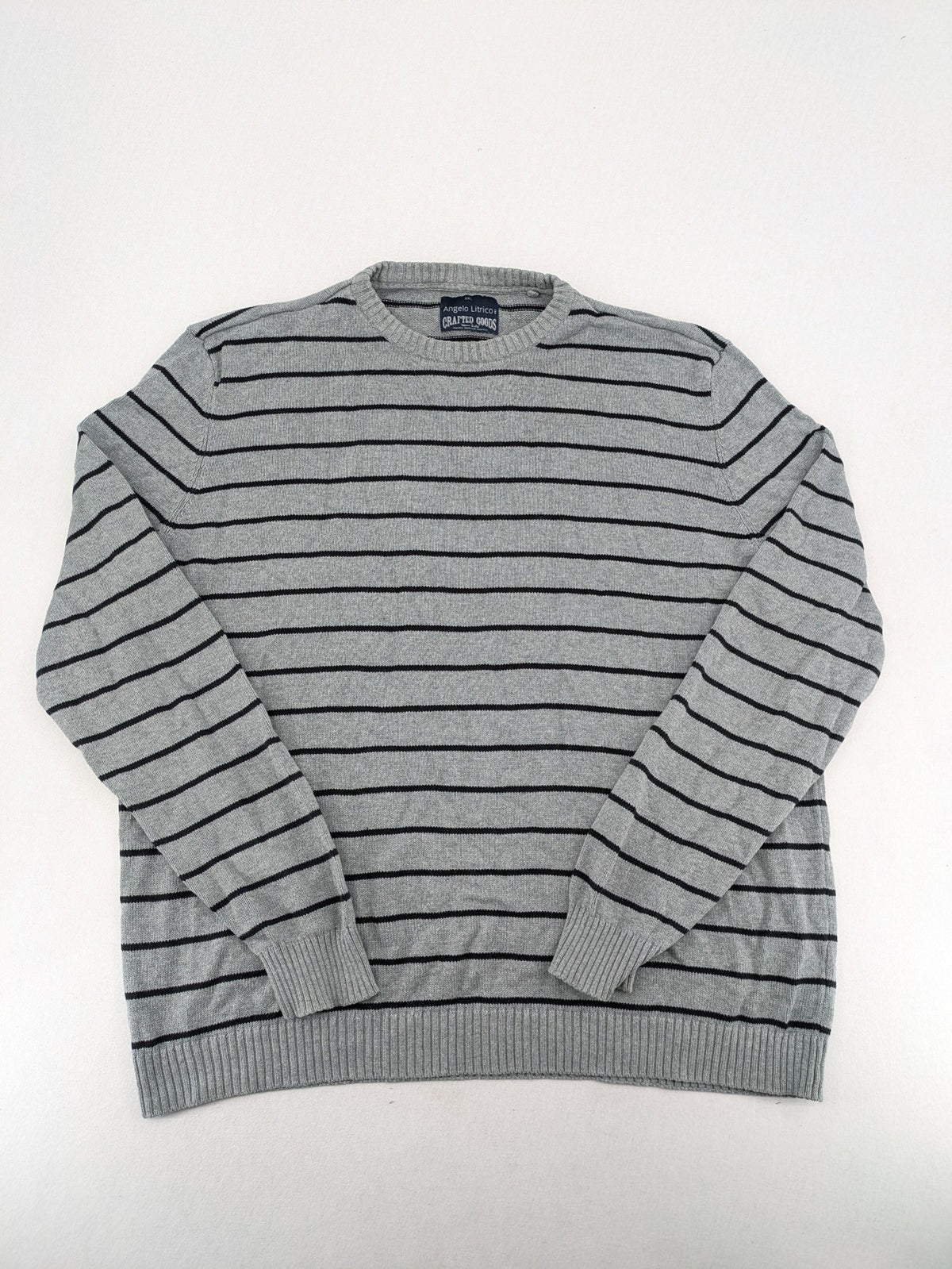 Angelo Litrico grey and black striped knit jumper, round neck, soft material.