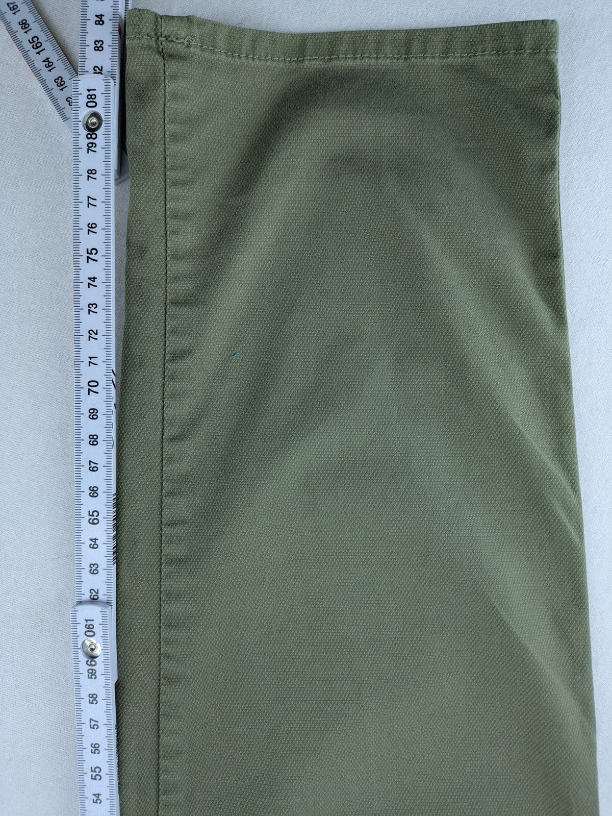 BRAX green chino pants flat-front design with zipper and buttoned back pockets.