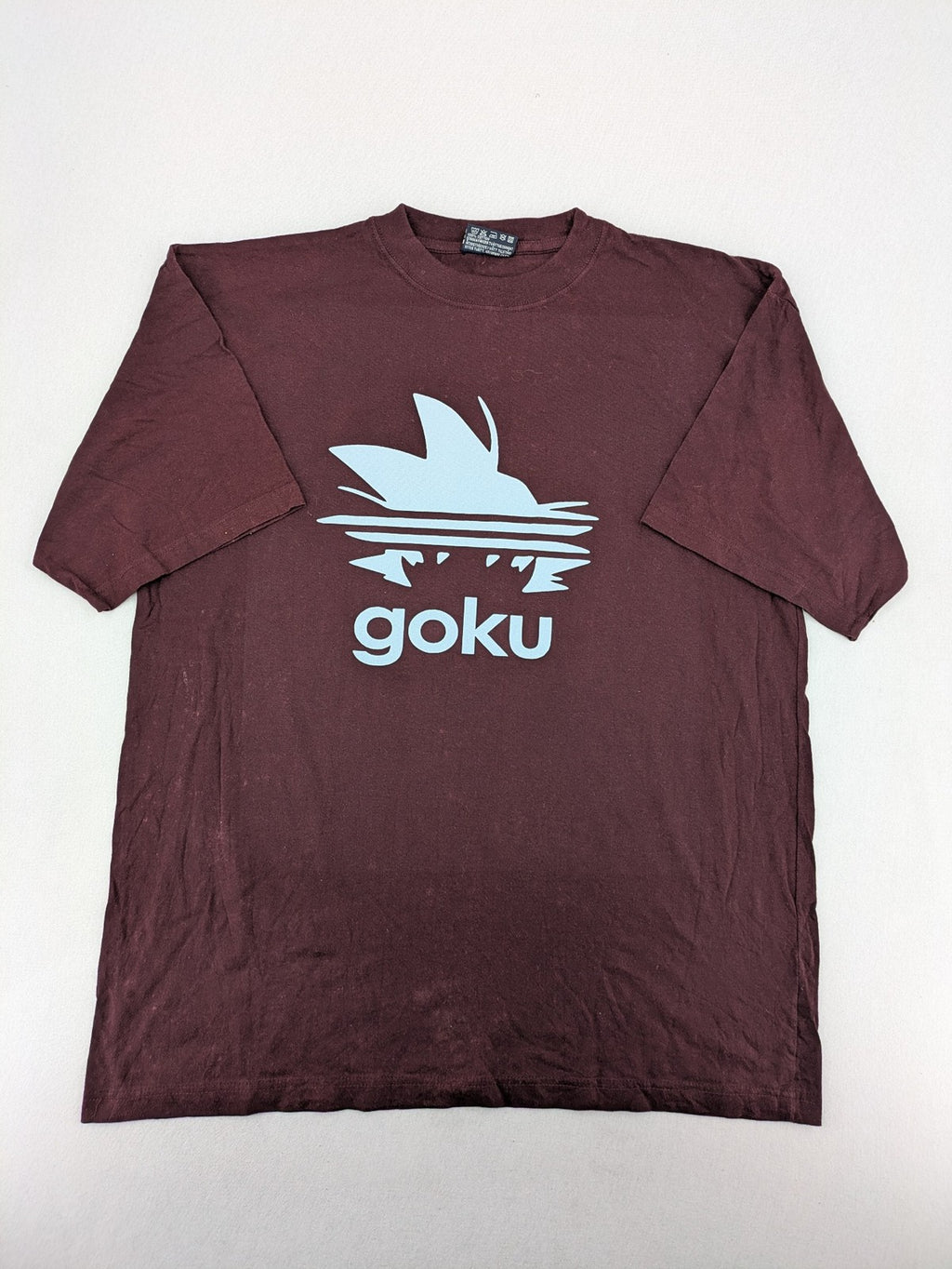 ADI band t-shirt burgundy with blue graphic parody of Adidas logo and Goku silhouette