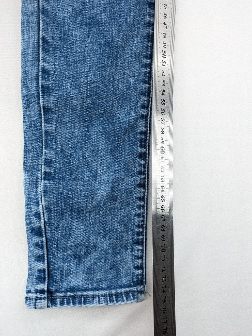 Retour blue slim fit jeans with classic 5-pocket style and adjustable waistband.