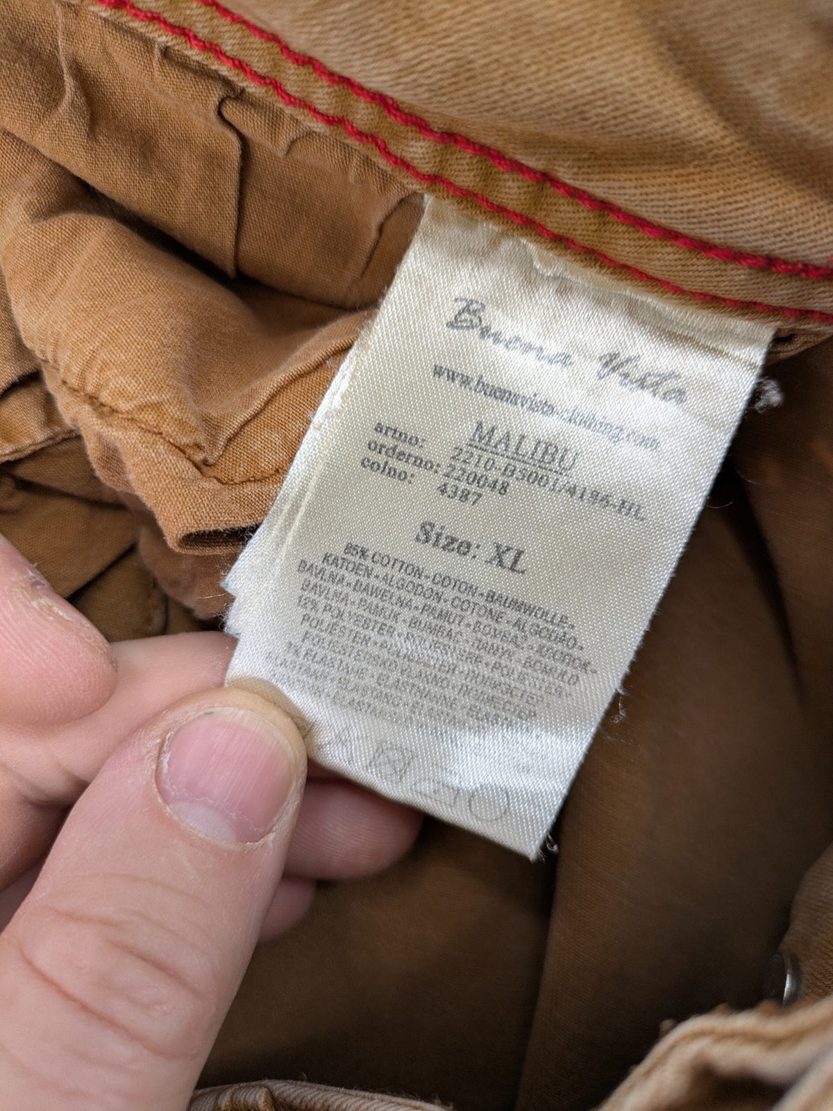 Buena Vista beige capri jeans with frayed hem and button fly detail.