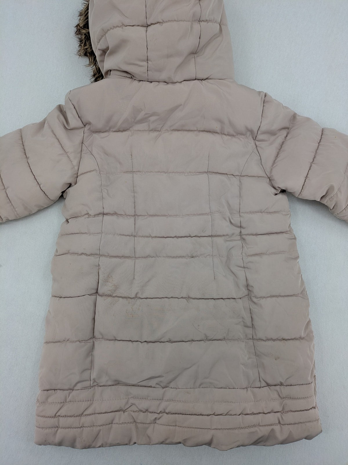Brit Island beige puffer coat with fleece lining and faux fur hood detail.