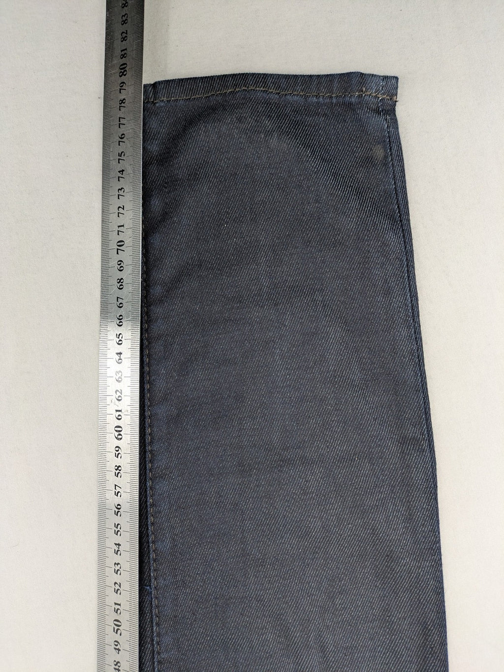 Hilfiger Denim blue straight jeans with double button closure and logo detail.