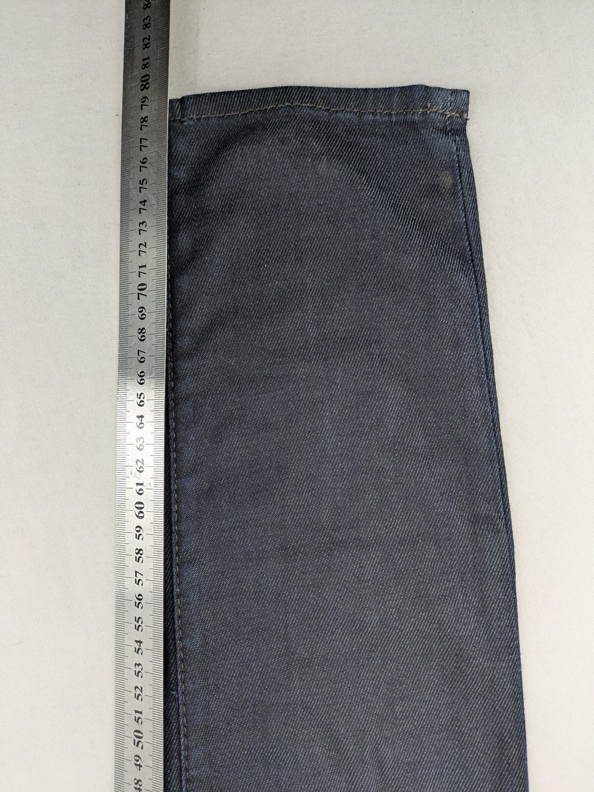 Hilfiger Denim blue straight jeans with double button closure and logo detail.