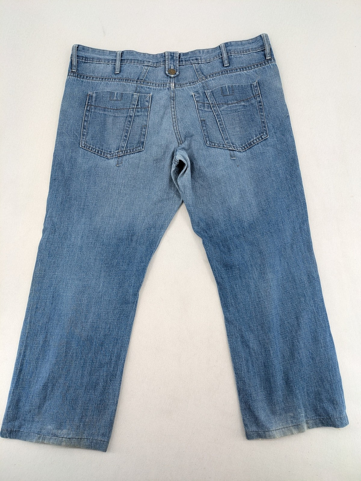 C&A blue straight jeans 5-pocket style with logo and button closure.