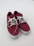 Vans low-top sneakers burgundy canvas with white logo and classic waffle sole.