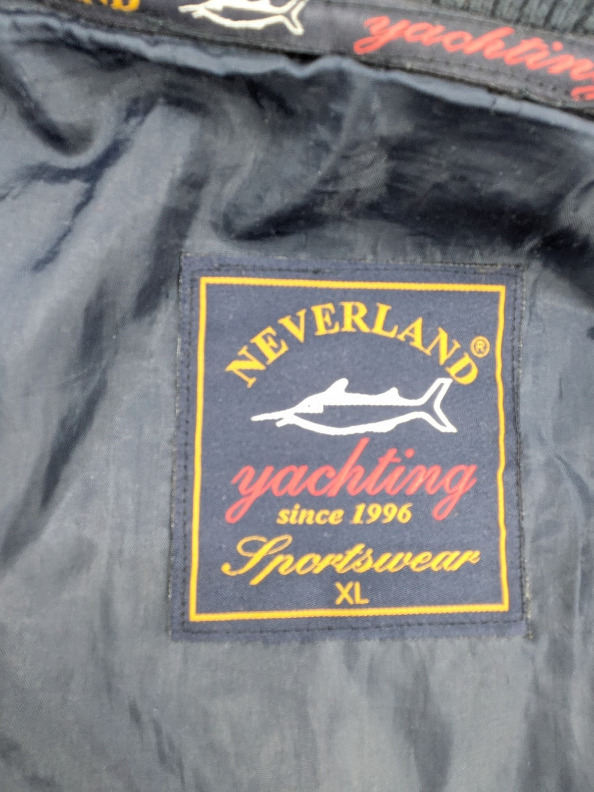 Neverland grey and navy full zip turtle neck jumper with ribbed knit and shoulder patches.