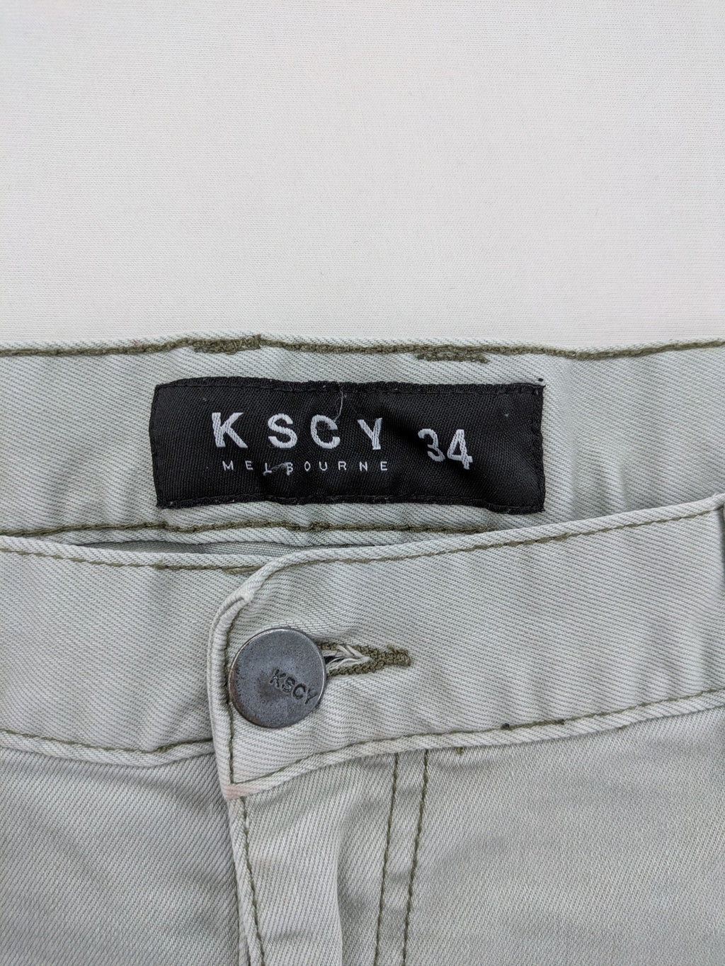 KSCY grey straight jeans with distressed details and ribbed biker inserts.