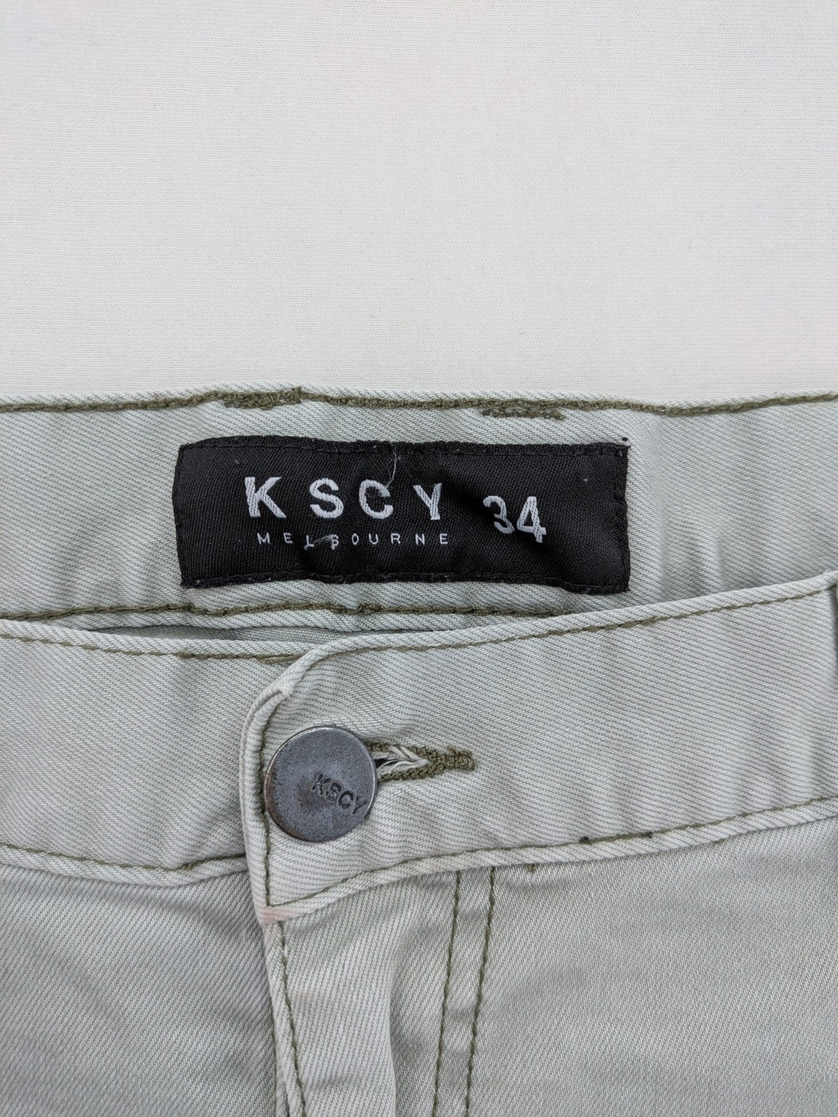 KSCY grey straight jeans with distressed details and ribbed biker inserts.
