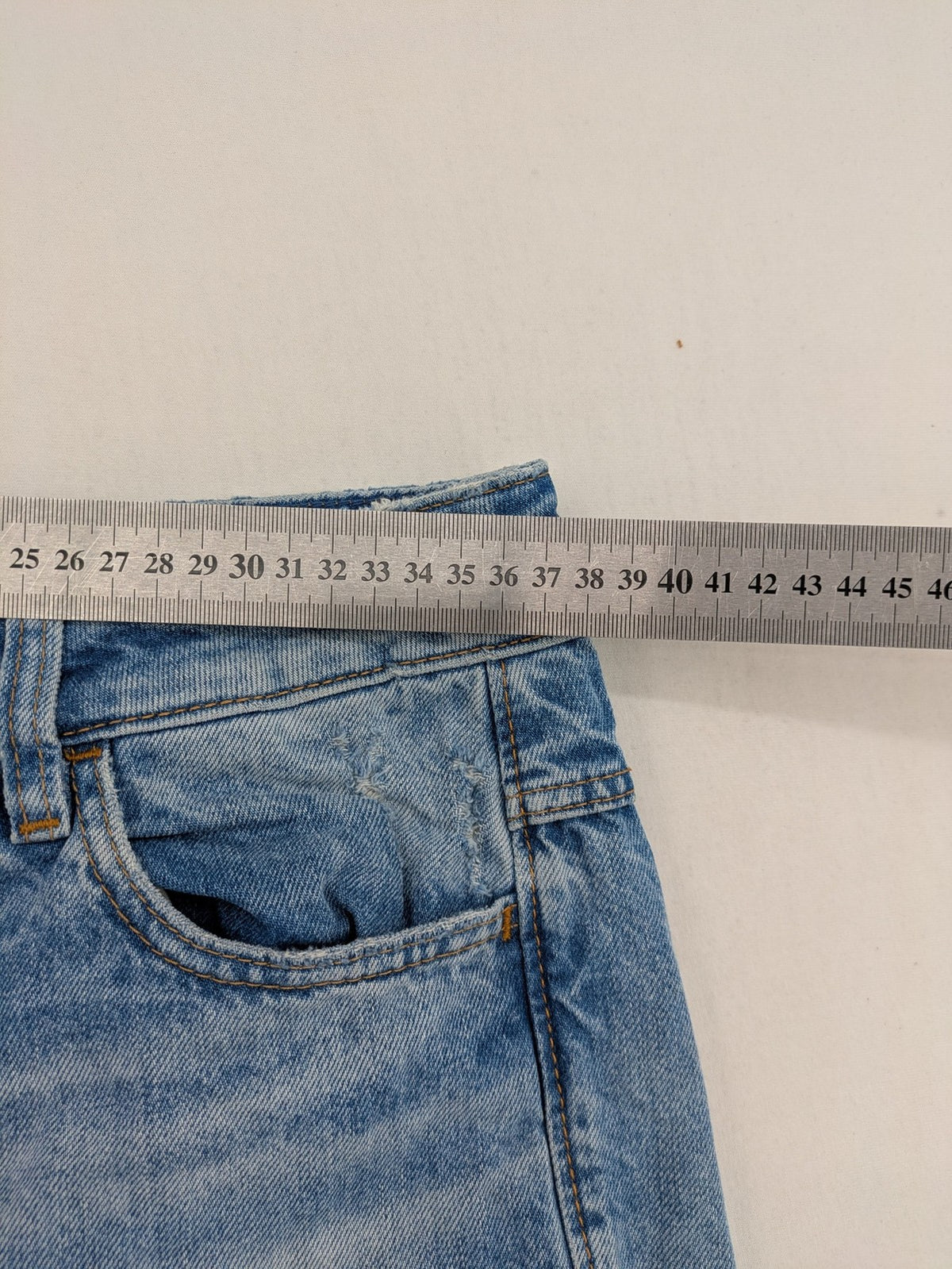 G-Star Raw blue distressed high boyfriend jeans with ripped details and classic button closure.