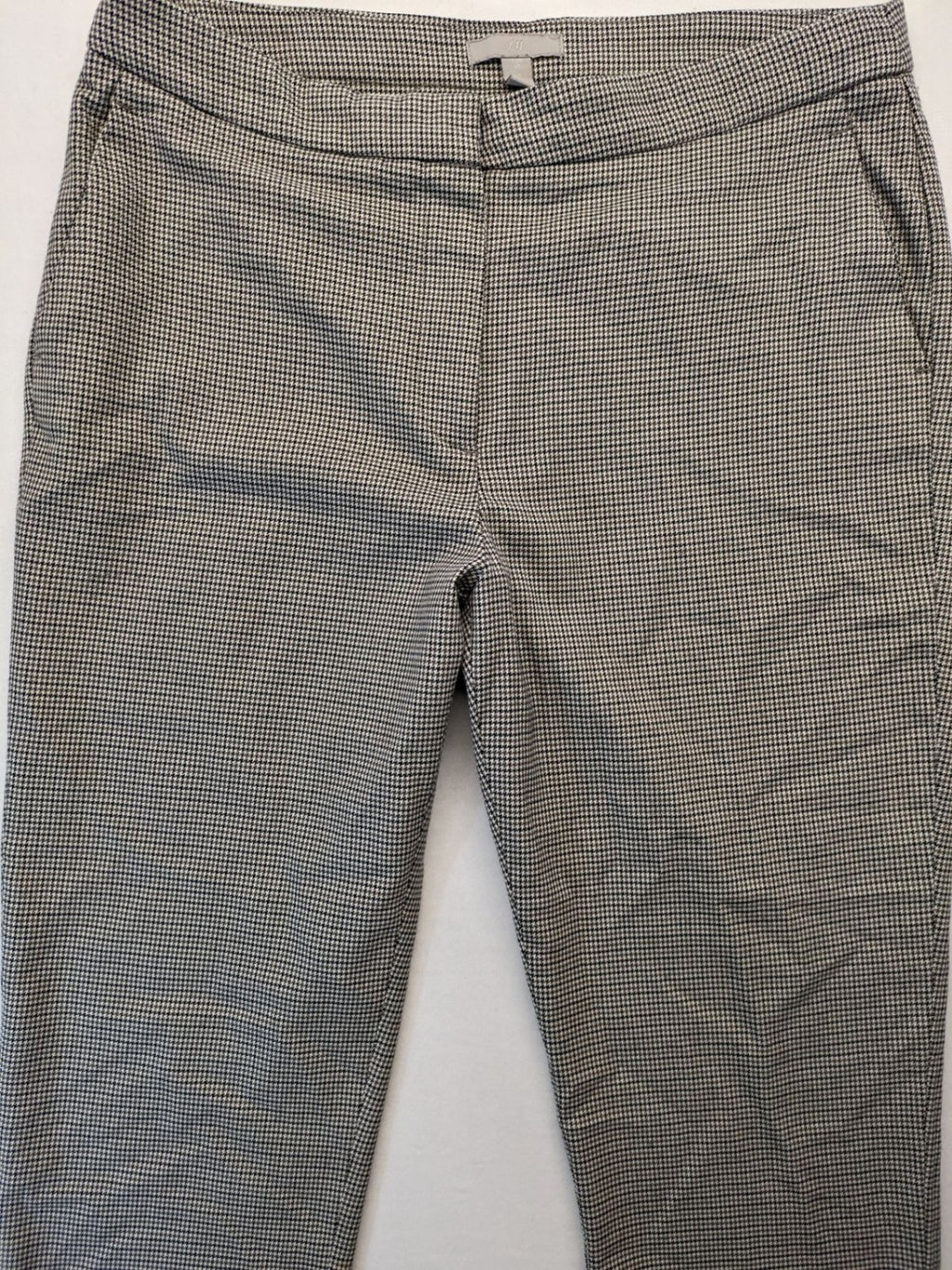 H&M beige pants houndstooth pattern with black and brown tones, stretchy material.