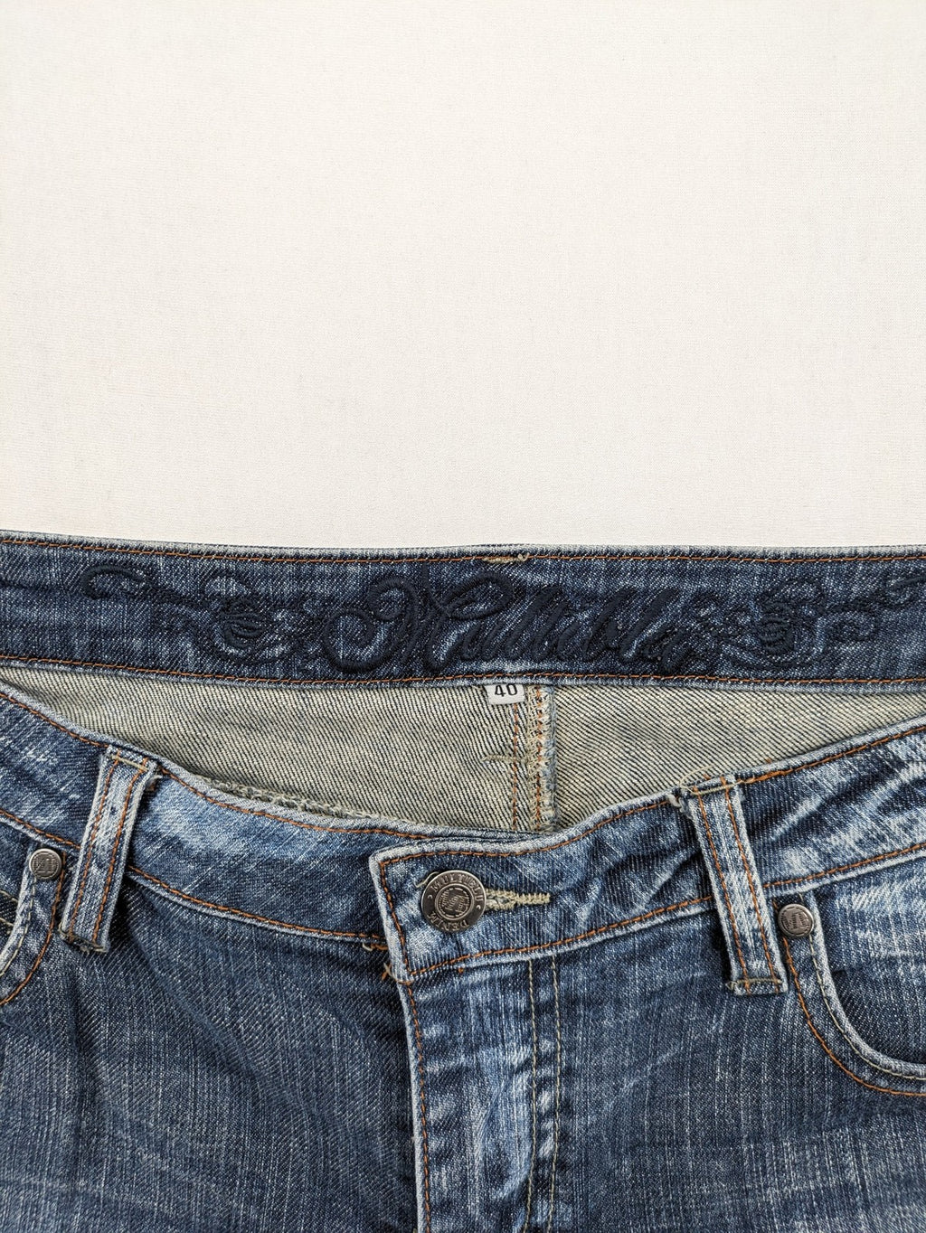 BLU blue straight jeans with washed effect, rolled hem, and five-pocket design.