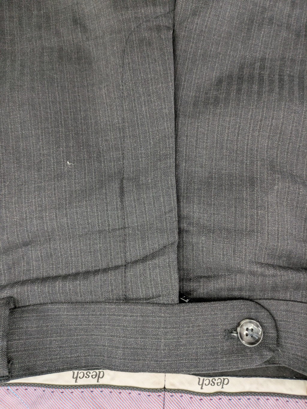 Desch grey suit pants with subtle pinstripe pattern and flat front design.