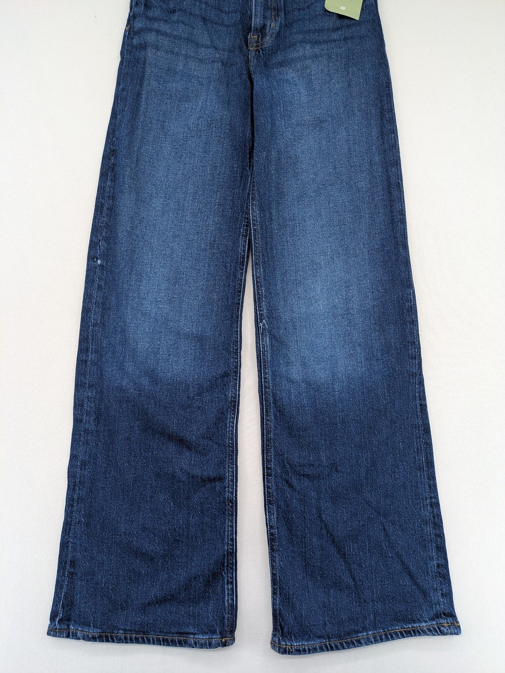 H&M blue wide leg high waist jeans with classic 5-pocket design and stretch denim.