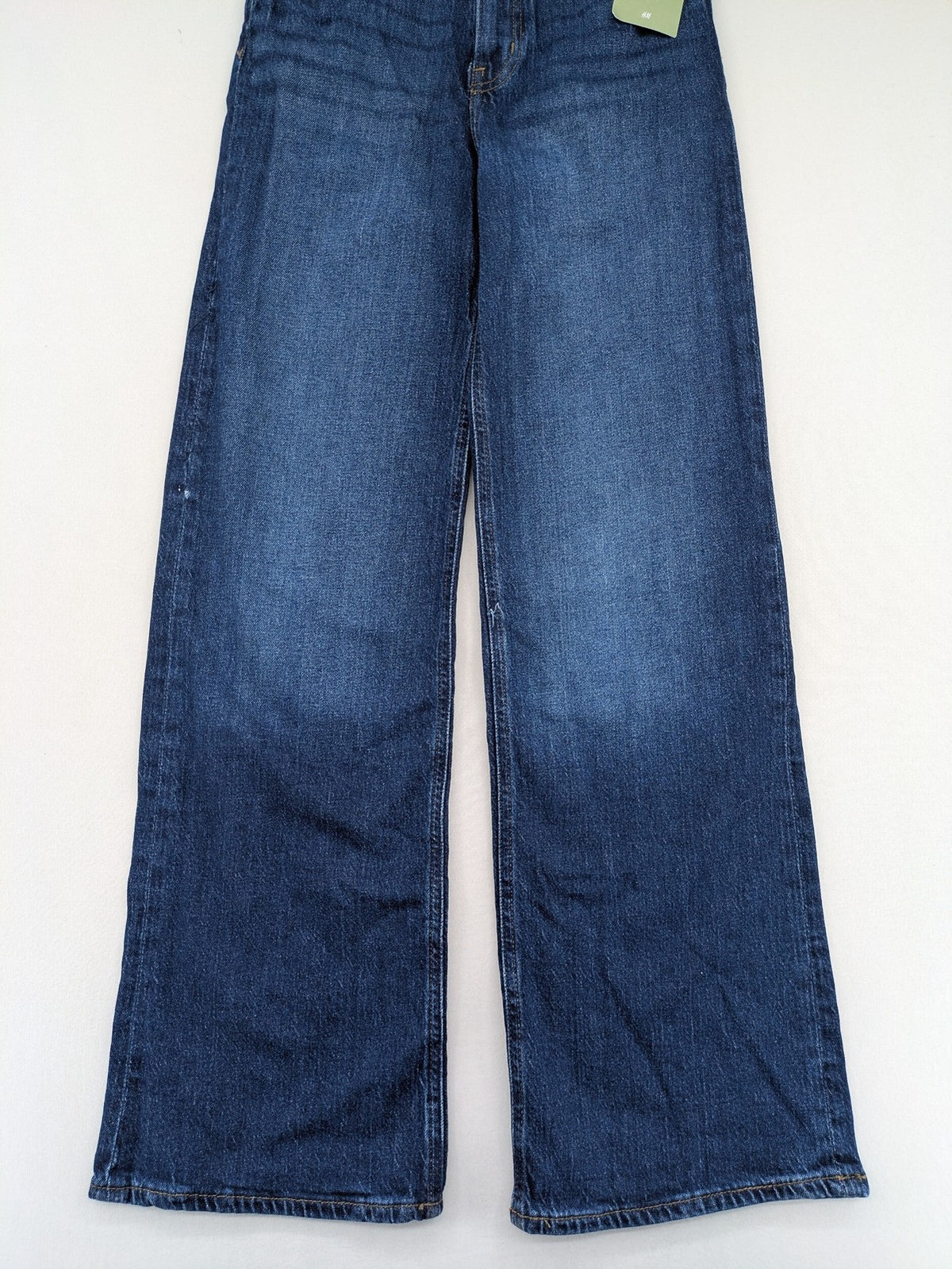 H&M blue wide leg high waist jeans with classic 5-pocket design and stretch denim.