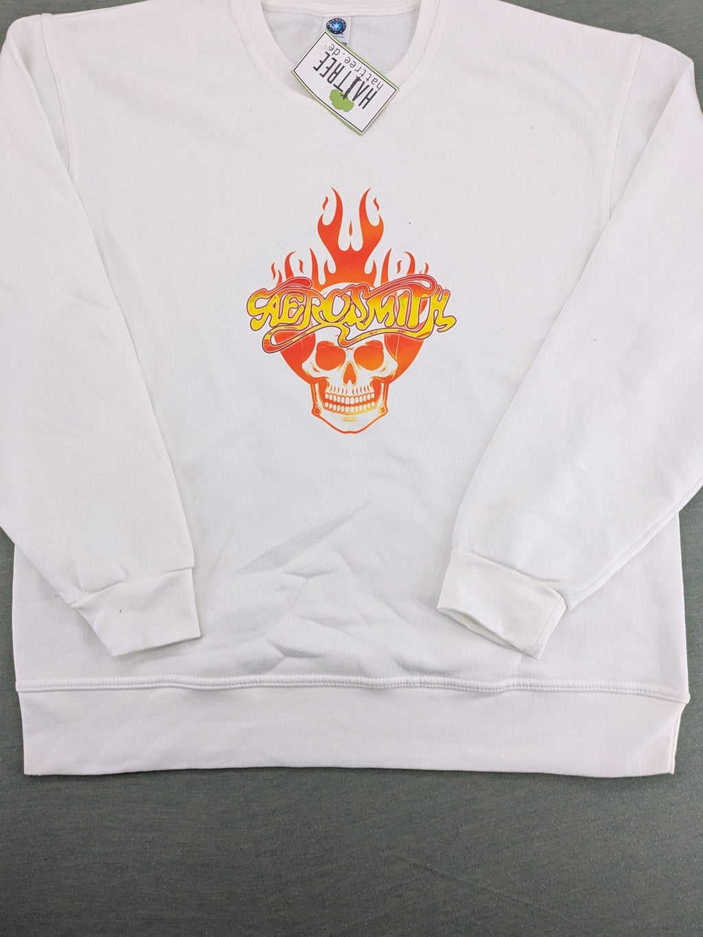 Aerosmith white sweatshirt with bold front graphic, logo, and flaming skull design.
