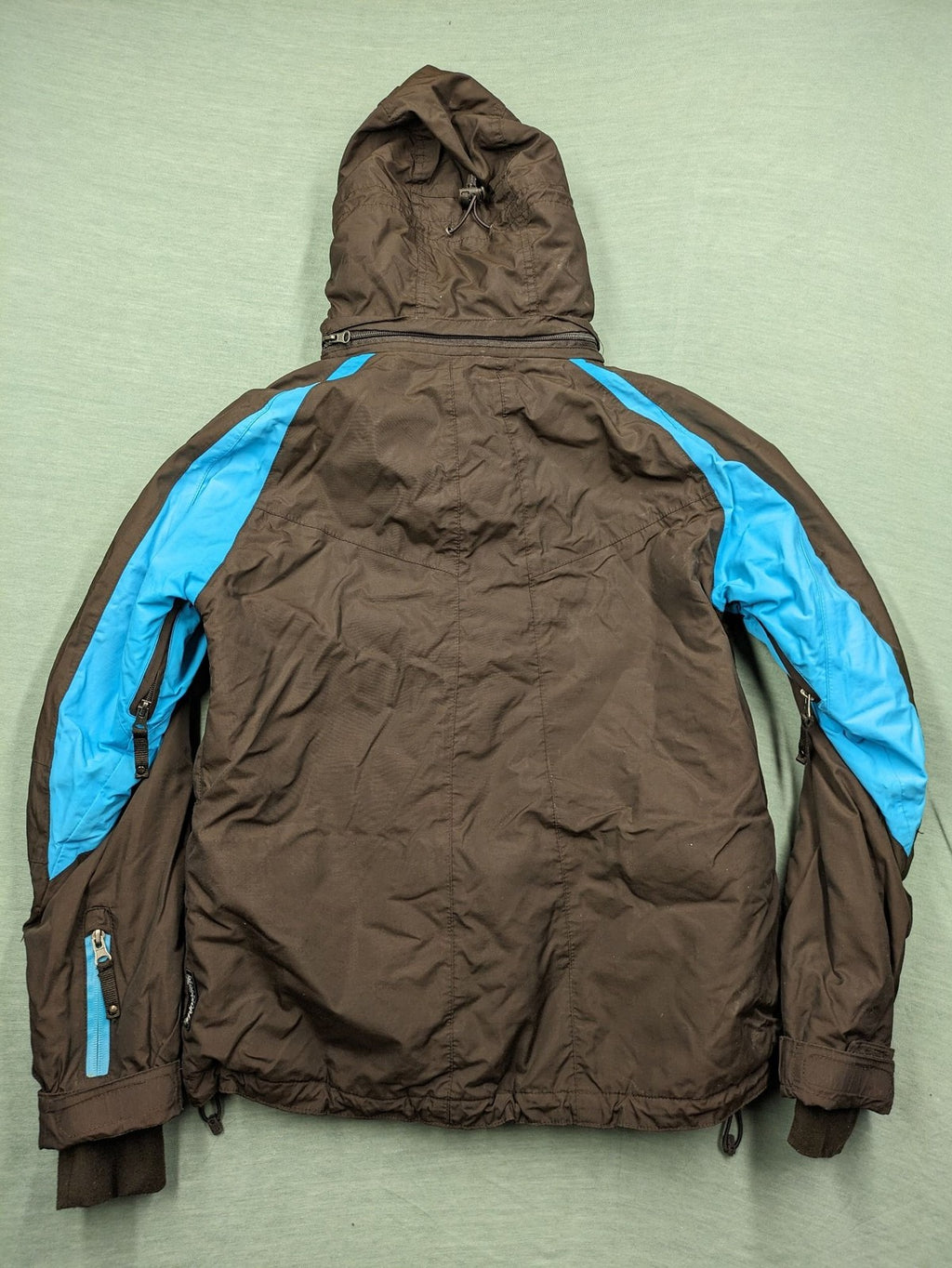 Thinsulate black and blue ski jumpsuit with hood and zippered pockets.