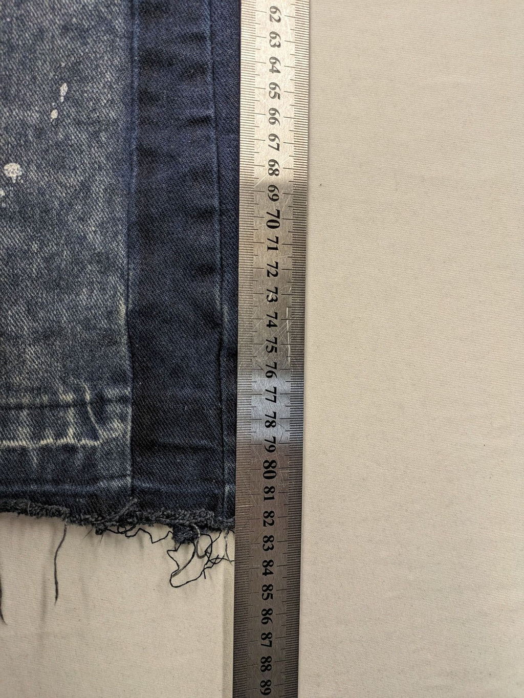 Reternity straight jeans blue black patchwork design with distressed details and frayed seams.