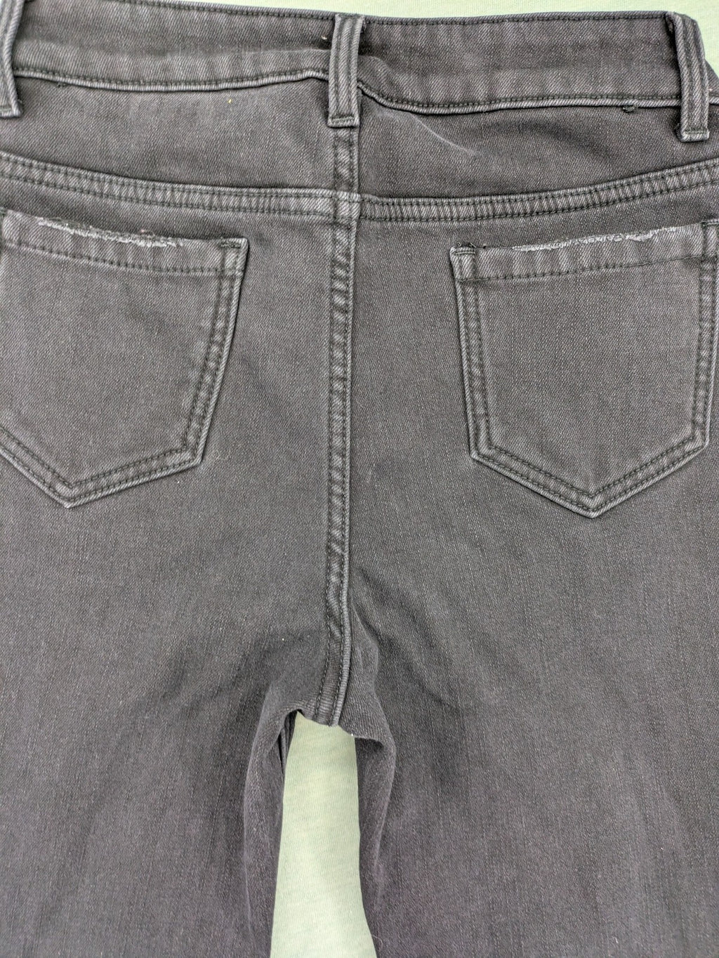 Disney black straight jeans with Minnie Mouse detail, cropped length, stretchy cotton blend.