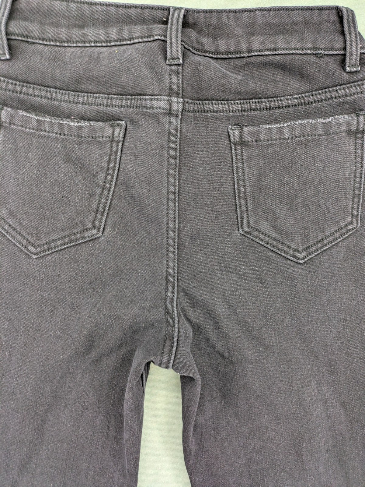 Disney black straight jeans with Minnie Mouse detail, cropped length, stretchy cotton blend.