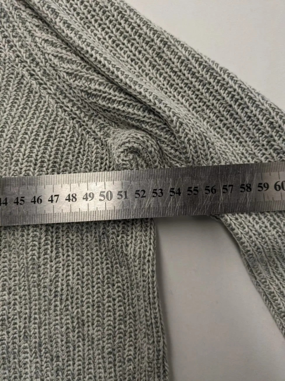 Autumn Glow grey turtle neck jumper with ribbed pattern and button detail.